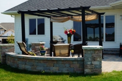 Seat Wall Enclosing Patio with Pergola in Northeast WI